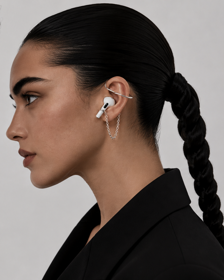 Model wearing the Echo Earcuff in sterling silver with an AirPod secured